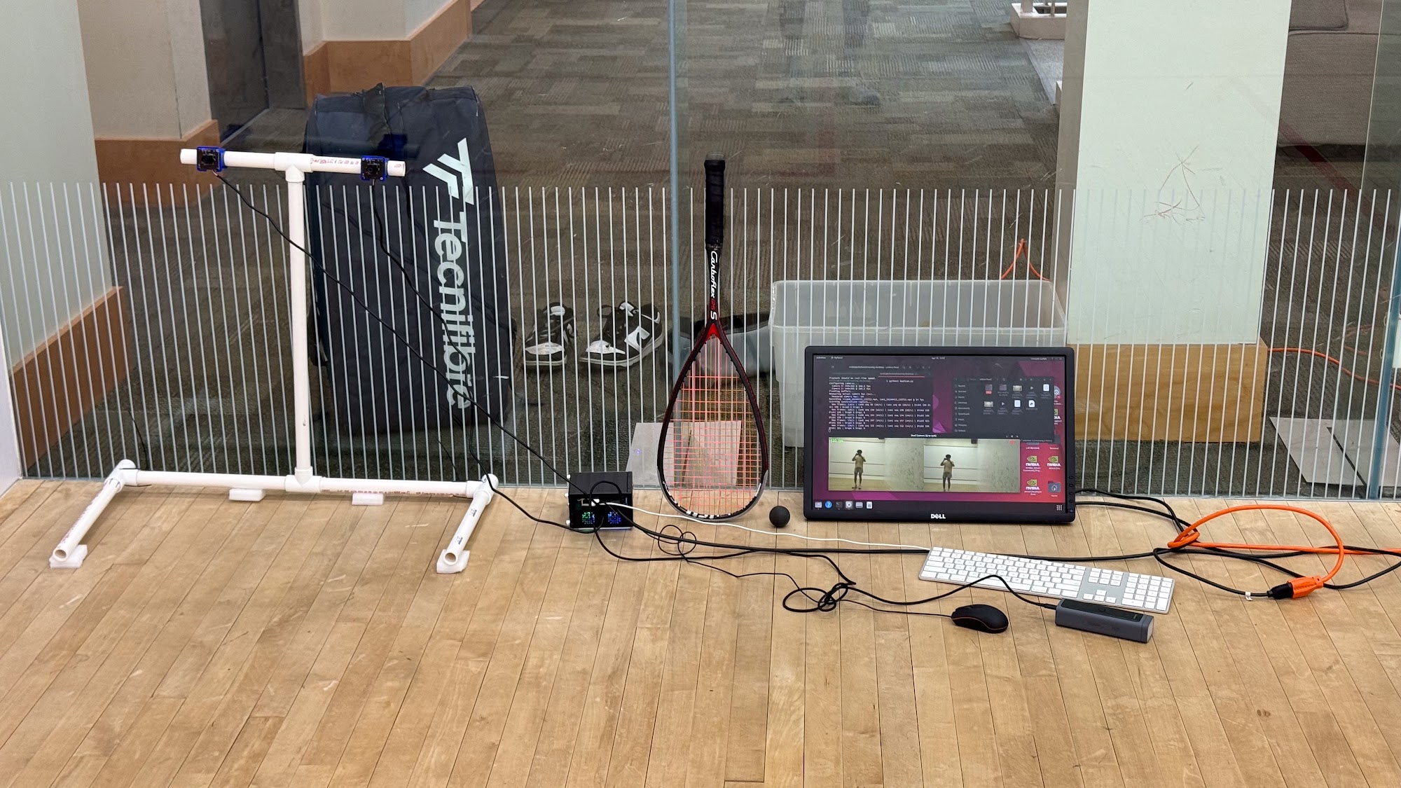 Stereo camera rig on squash court with Jetson and monitor